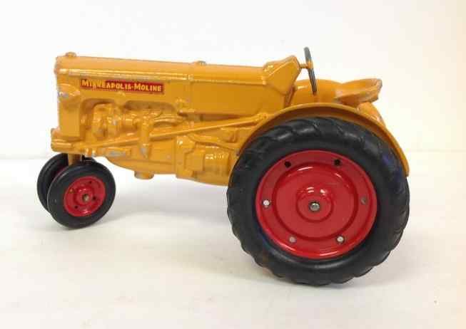 MINNEAPOLIS-MOLINE EARLY 1950'S TOY DIE CAST FARM: MINNEAPOLIS-MOLINE EARLY 1950'S TOY DIE CAST FARM TRACTOR, MEASURES 9" FRONT TO BACK, HAS SOME WEAR ON YELLOW PAINT, FROM OLD FAMILY ESTATE IN COLORADO, AS PICTURED