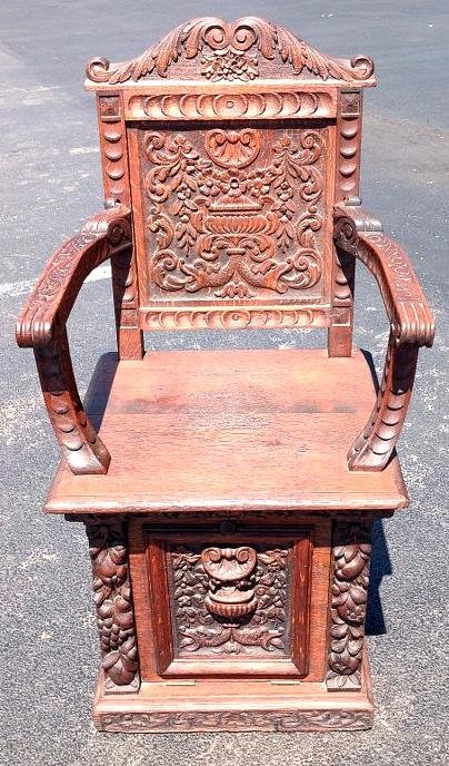 HEAVILY CARVED ORNATE OAK ARMCHAIR WITH PULL OUT COAL (1 of 3)
