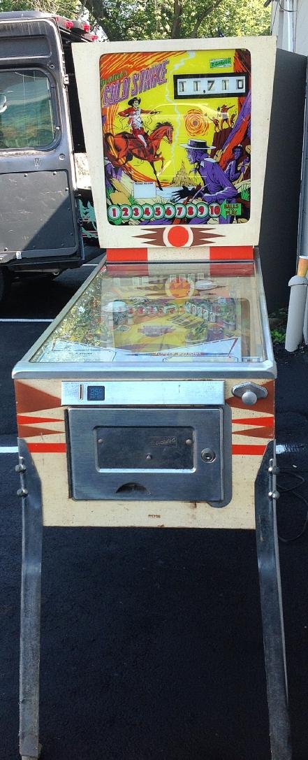 GOTTLIEB GOLD STRIKE 1975 PINBALL MACHINE, ALWAYS TAKEN: GOTTLIEB GOLD STRIKE 1975 PINBALL MACHINE, ALWAYS TAKEN CARE OF, NICE BACKGLASS, PLAYING FIELD, AND BODY. WAS PLAYING WITH OTHER MACHINE AS WE TOOK OUT. OWNER MOVING SOUTH. NOT MANY OF THESE WERE MADE