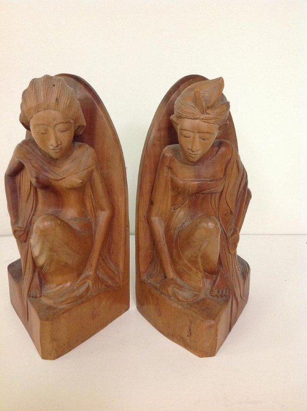 PR OF CARVED INDONESIAN BOOKENDS, 2 WOMEN, LABELS ON: PR OF CARVED INDONESIAN BOOKENDS, 2 WOMEN, LABELS ON BOTTOM, OWNERS RECEIVED AS A WEDDING GIFT, CIRCA 1950'S, MEASURE 9" HIGH, AS PICTURED