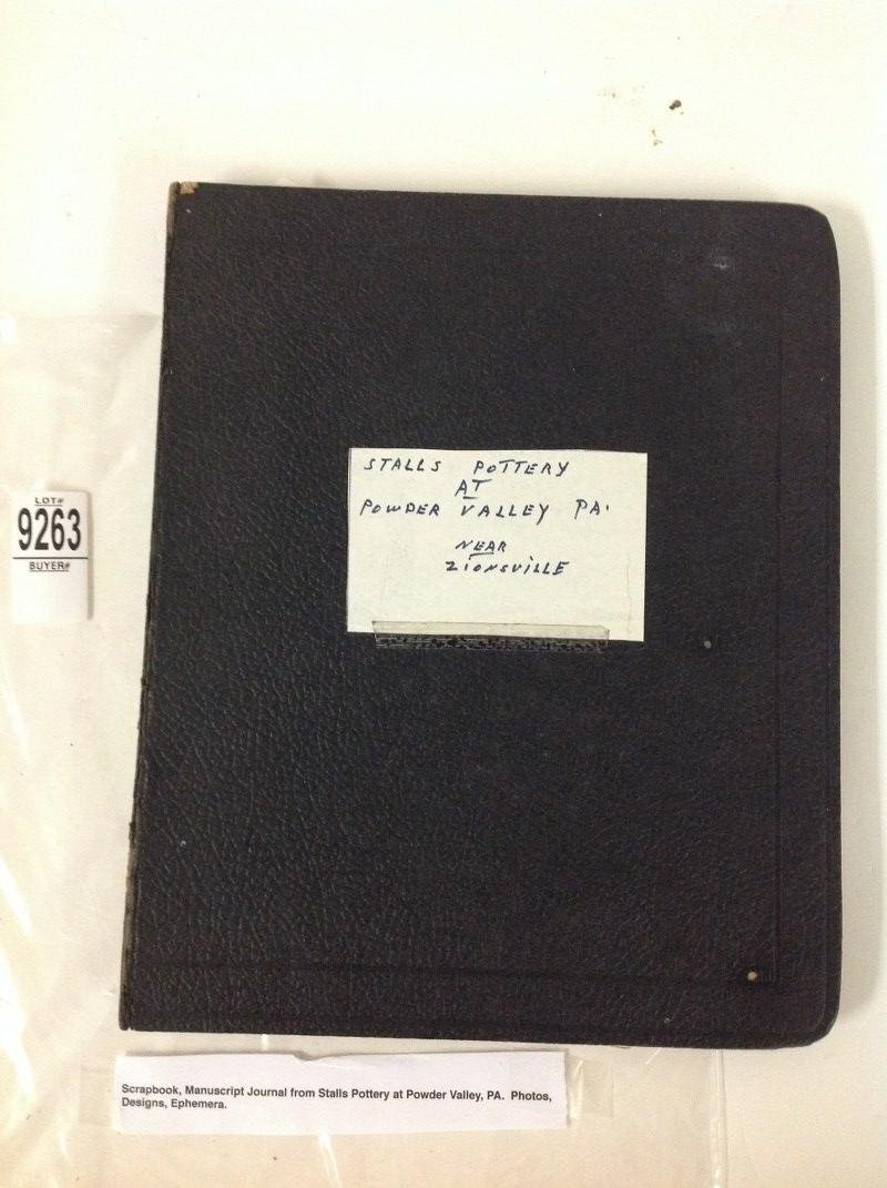 SCRAPBOOK/MANUSCRIPT JOURNAL FROM STALLS POTTERY AT: SCRAPBOOK/MANUSCRIPT JOURNAL FROM STALLS POTTERY AT POWDER VALLEY, PA., INCLUDES PHOTOS, DESIGNS, AND OTHER EPHEMERA, FIRST PAGE RIPPED, COVER AND SPINE HAVE WEAR, AS PICTURED