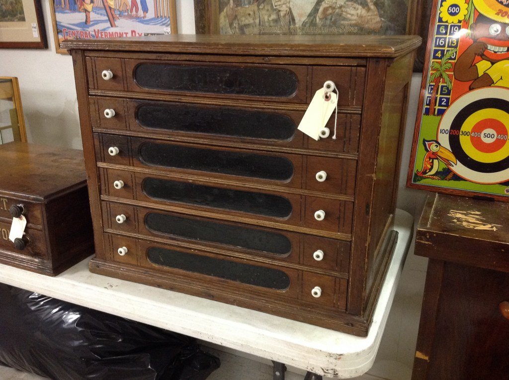 6 DRAWER WALNUT SPOOL CABINET, MEASURES 25" WIDE, 20": 6 DRAWER WALNUT SPOOL CABINET, MEASURES 25" WIDE, 20" HIGH, 17 1/2" DEEP, AS PICTURED