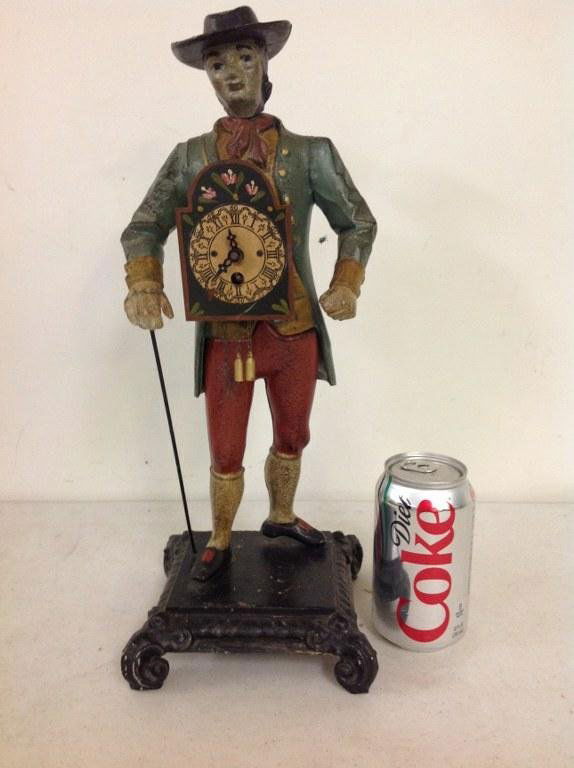 FIGURAL CAST IRON CLOCK PEDDLER, MEASURES 16" HIGH, (1 of 3)