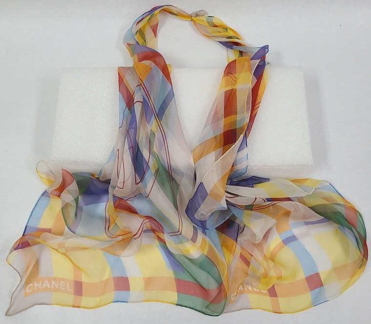 2 Coco Chanel Colorful Scarves: 2 Chanel scarves tied together. Each measures 22" square.