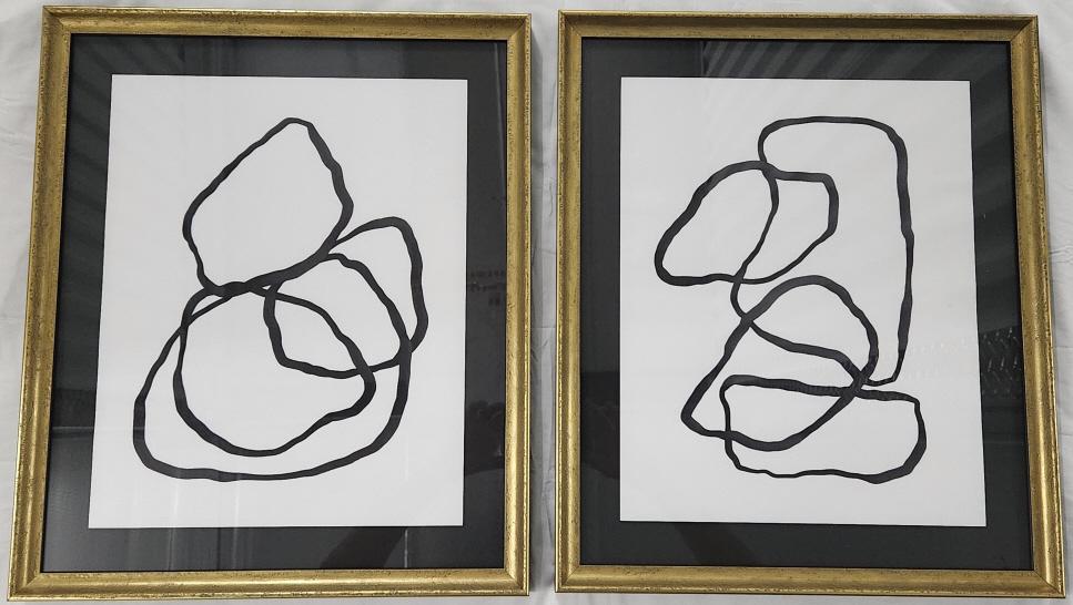 Framed Abstract Line Art Paintings: Abstract line art done in bold black against a white backdrop. Both paintings are displayed in frames that measure 16" x 19". Estimated domestic US shipping cost for this auction lot is $40 to $85, de