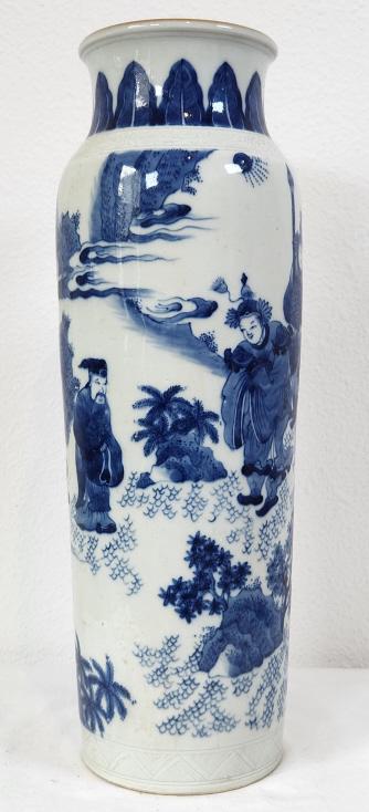 Antique Chinese Blue and White Sleeve Vase: Blue and white porcelain figural sleeve vase, features an Imperial scene among the clouds. The vase measures 16" in height and has a 4.5" wide base.