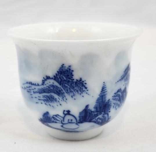 Blue and White Porcelain Tea Cup: This cup measures 2.5" in diameter, and is approximately 2" tall. Features a 4-character blue reign mark on the bottom, likely late 19th Century in origin.