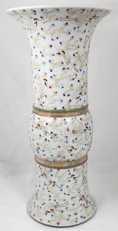 Chinese Xuantong Make Flaring Crane Vase: Chinese flaring porcelain vase featuring an array of cranes against a white glaze. The vase measures 18.5" tall and 7" in diameter at the base. The bottom of the vase has a clean, red Xuantong Period 