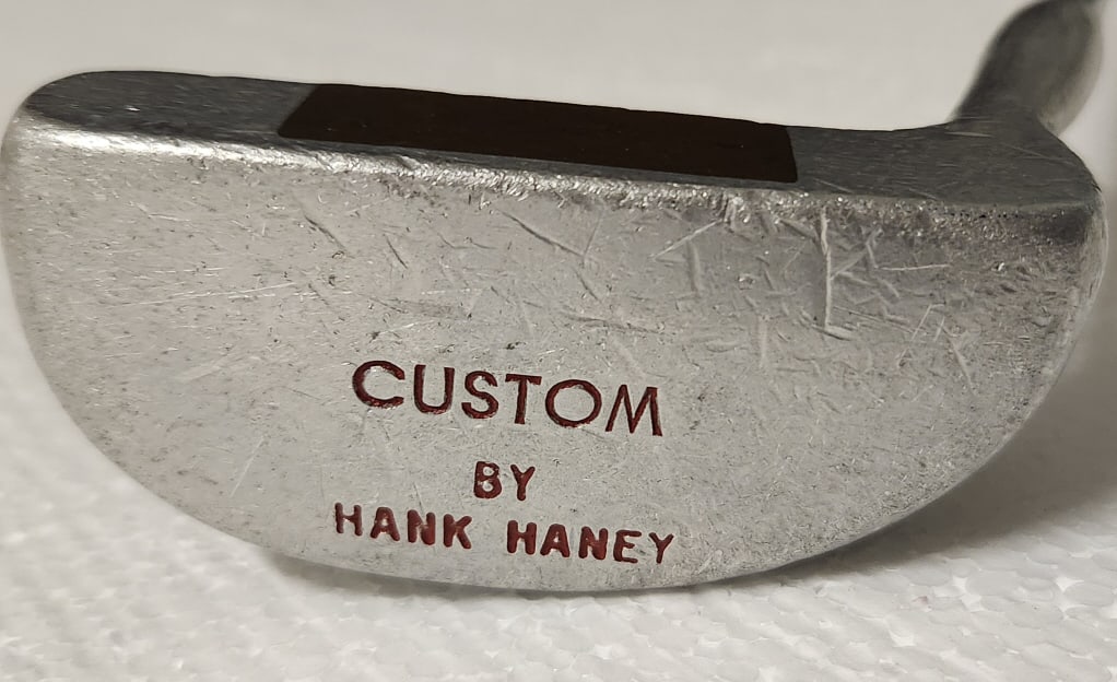 Tiger Woods Golf Coach Hank Haney Custom Putter: Custom golf club designed by Hank Haney. Possibly one of a kind. Haney was Tiger Woods's coach from 2004 to 2010. The club measures 35 1/2" long and has "Custom made by Hank Haney" on the bottom of th