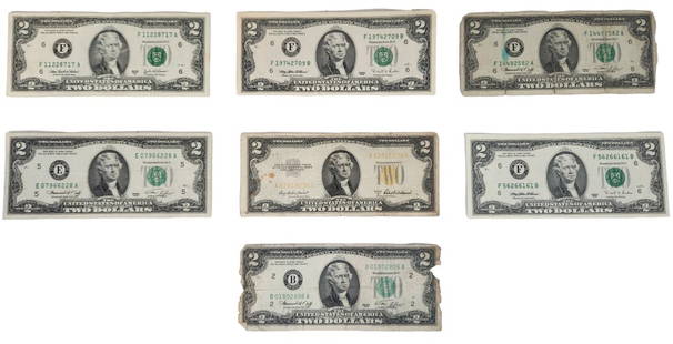 U.S. $2 Currency Note Lot incl. 1953A Gold Seal: Seven United States currency $2 bills, including a Series 1953A gold seal note. Please see photos provided for condition details. All bills include a protective plastic sleeve.