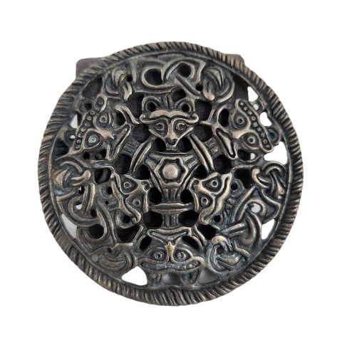 Antique Viking Silver Borre Style Disc Brooch: Borre Style Viking disc brooch, reportedly silver in content, featuring deity and animal faces, possibly a fox with a pin back and intact clasp. This piece is very similar to ones that were found as p