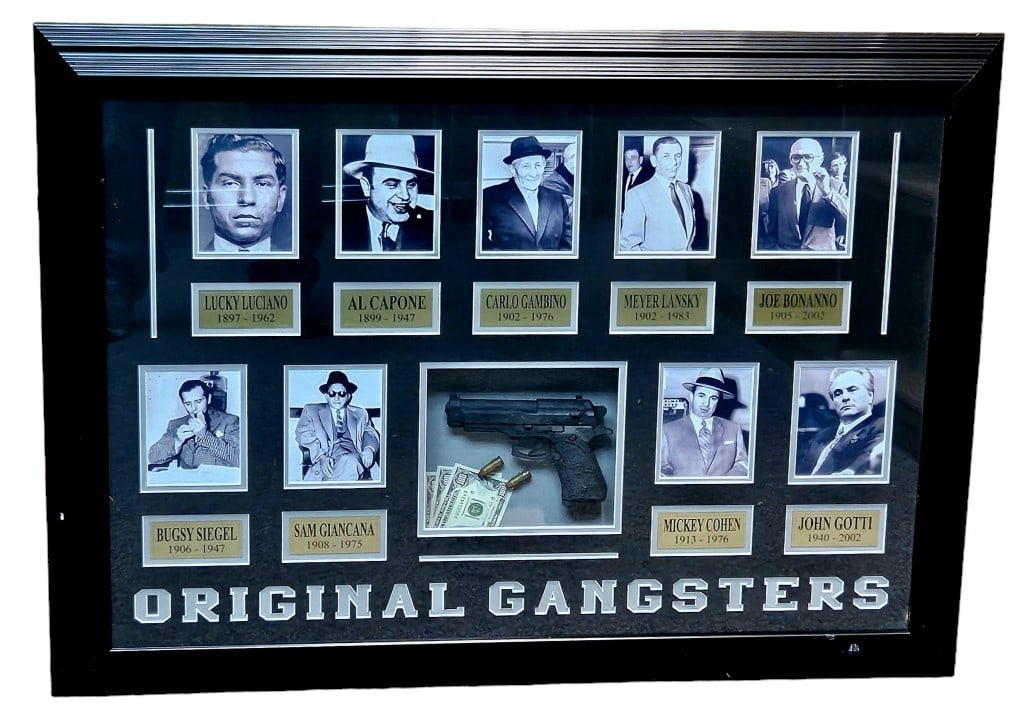 Original Gangsters Artistic Display Piece: 36.5" by 26.5" framed out shadow box with boack and white photo prints of famous mobsters such as Lucky Luciano, Al Capone, Bugsy Siegel, John Gotti and more. A fake gun, ammunition and money add to t