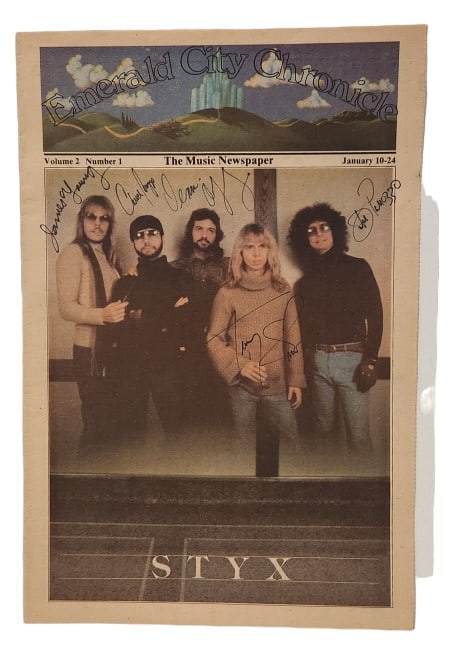 Styx 1977 Band Signed Newspaper: Emerald City Chronicle publication signed by members of the band Styx, 1977 lineup. 11 1/2" x 17" newsletter. Does NOT INCLUDE a COA, please see the photos provided for more details.