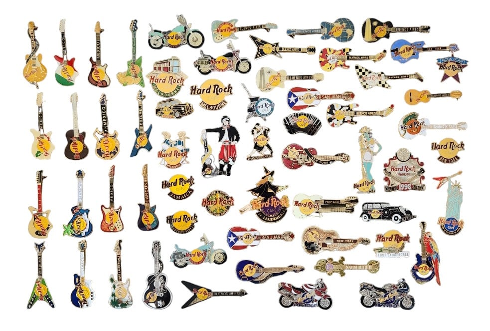 Hard Rock Cafe Casino World Guitar Pins: Over 50 enamel trading pins from the Hard Rock family of Casinos, Hotels, and Cafes. The pins are housed in a shadowbox case measuring 18" x 12" x 1 3/4". Some pins may have foam stuck to the back due