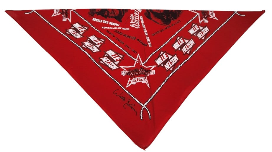 Willie Nelson and Family Concert Crew Bandana: Bandana given to crew members by the Willie Nelson crew during a NY concert stop of his Willie Nelson and Family tour. The bandana measures 21" X 21" and features illustrations of Nelson and song name