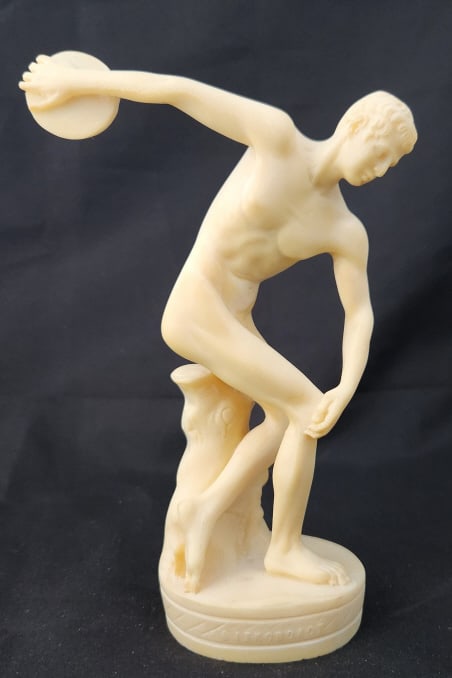 Discobolus of Myron Vintage Italian Sculpture: Italian alabaster or resin sculpture of "Discobolus of Myron". Measures 5 1/2" W x 8" H x 2 1/2" D . Weighs 14 oz.