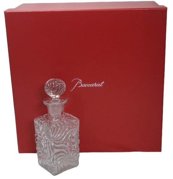 Baccarat Square Pinwheel Perfume Bottle with Box: Baccarat Crystal perfume bottle. 7" x 2 1/2" x 2 1/2". Box is 6 1/2" x 11 1/2" x 11 1/2". 1.25 LBs. Ships for less than $50 anywhere in the Continental United States.