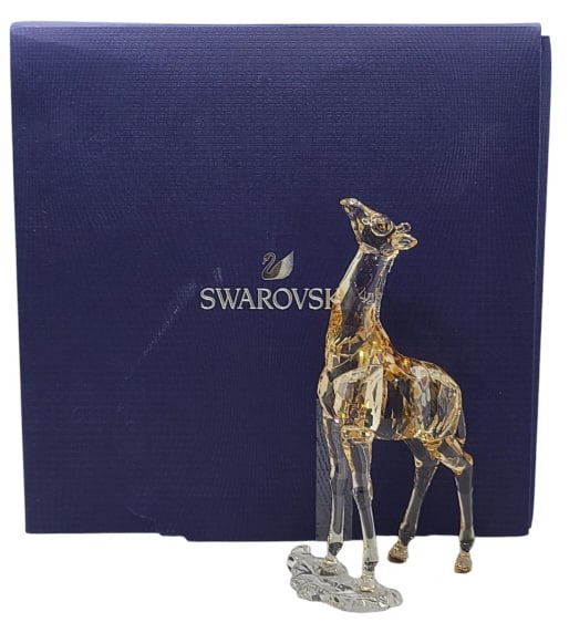 Swarovski 2018 Baby Mudiwa Giraffe Figure: Swarovski 2018 Baby Mudiwa Giraffe #5302151. Includes original box. In excellent condition.