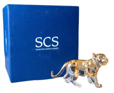 Swarovski 2010 SCS Tiger Cub Standing Figure: Swarovski 2010 SCS Tiger Cub Standing Figure #1016577 in original box. A small piece at 3 1/2" x 2". In excellent condition.
