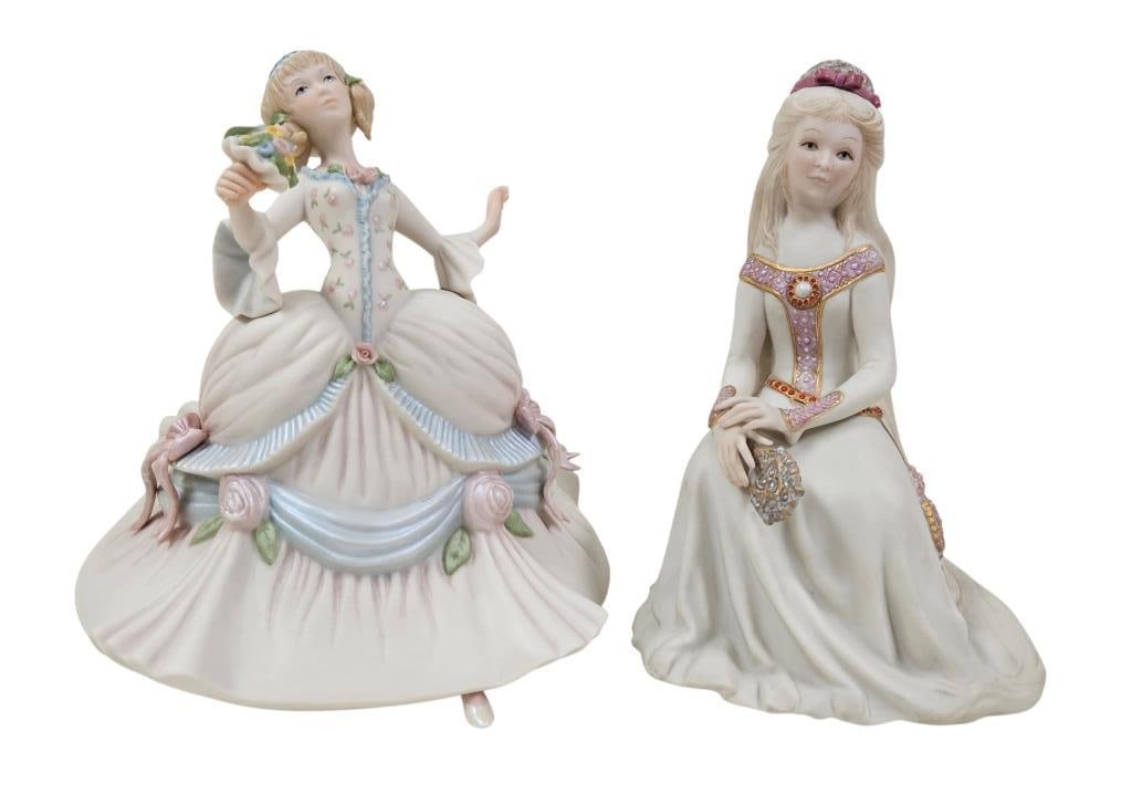 Cybis Rapunzel & Cinderella Fairy Tale Figurines: Two vintage Cybis porcelain bisque fairy tale figurines. Includes Rapunzel seated; signed Cybis and numbered 256 from a limited Run. Cinderella at the Ball in lilac; signed Cybis on the base. Both app