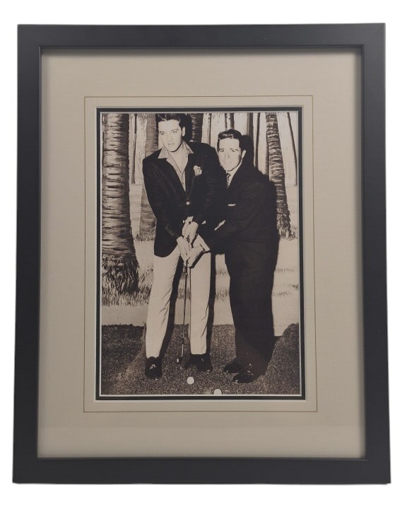 Elvis Presley & Gary Player Framed BW Photograph: IMPORTANT NOTE: Legacy Auctions offers reasonably priced in-house and 3rd Party shipping options, but you must select Arrange My Own Shipping as part of your post-auction purchase options. Framed blac
