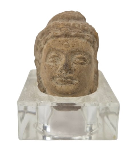 Gandharan Stucco Head Buddha Likely 3rd-5th C. AD: IMPORTANT NOTE: Legacy Auctions offers reasonably priced in-house and 3rd Party shipping options, but you must select Arrange My Own Shipping as part of your post-auction purchase options. Gandharan
