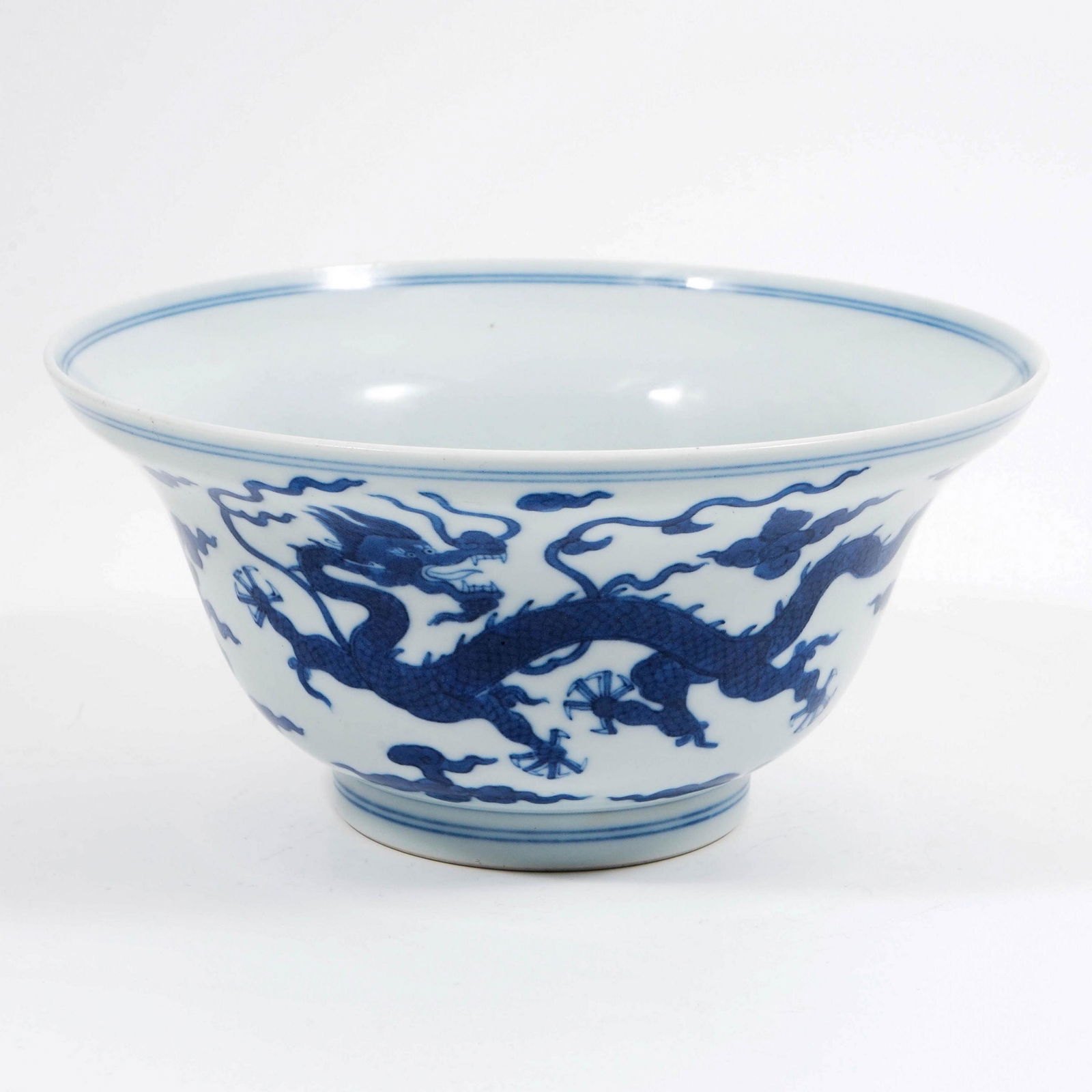 A underglaze blue bowl with dragon pattern in the (1 of 6)