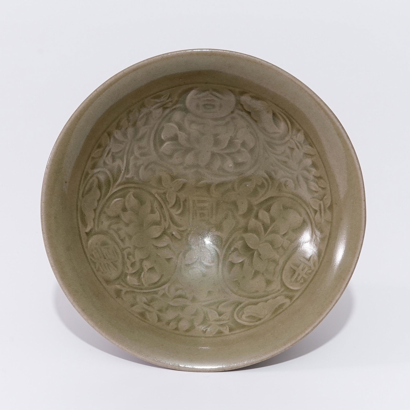 A  Yaozhou ware celadon bowl with a floral pattern in the Jan Dynasty (1 of 4)