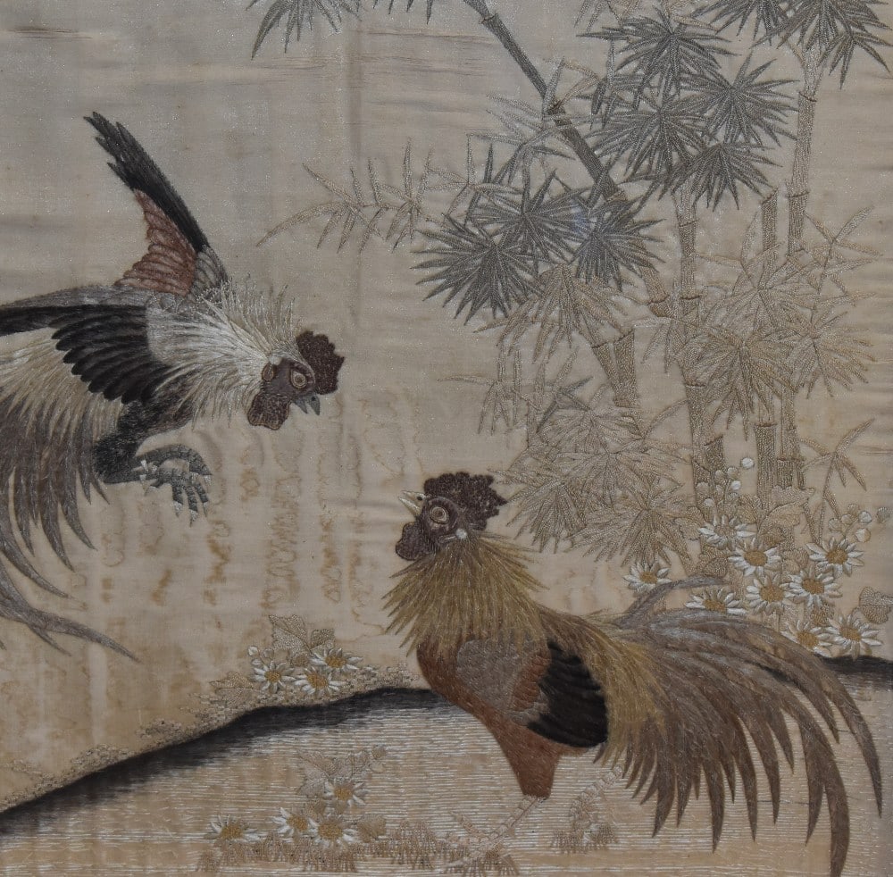 19th Century Chinese School, a silk embroidered panel depicting two fighting cockerels, framed,: 19th Century Chinese School, a silk embroidered panel depicting two fighting cockerels, framed, mounted, and under glass, measuring 50cm x 50cm, & 68cm x 68cm overall, together with another silk e