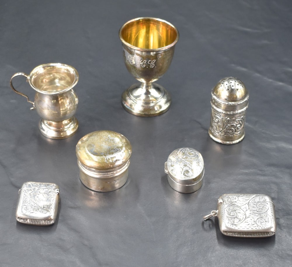 A group of miscellaneous silver items, comprising two vesta cases, pepperette, oval pill box,: A group of miscellaneous silver items, comprising two vesta cases, pepperette, oval pill box, circular box, miniature tankard and egg cup, various dates and makers, gross weight 128grams