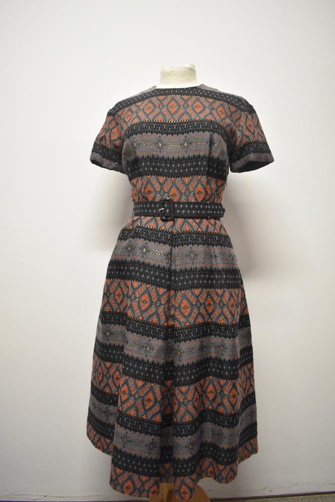 A late 1950s / 1960s day dress, having pleats to skirt, short sleeves and matching belt. (1 of 7)