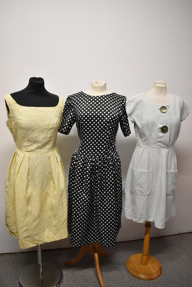 Three vintage dresses, to include 1950s day dress of textured cotton with large green buttons to (1 of 5)