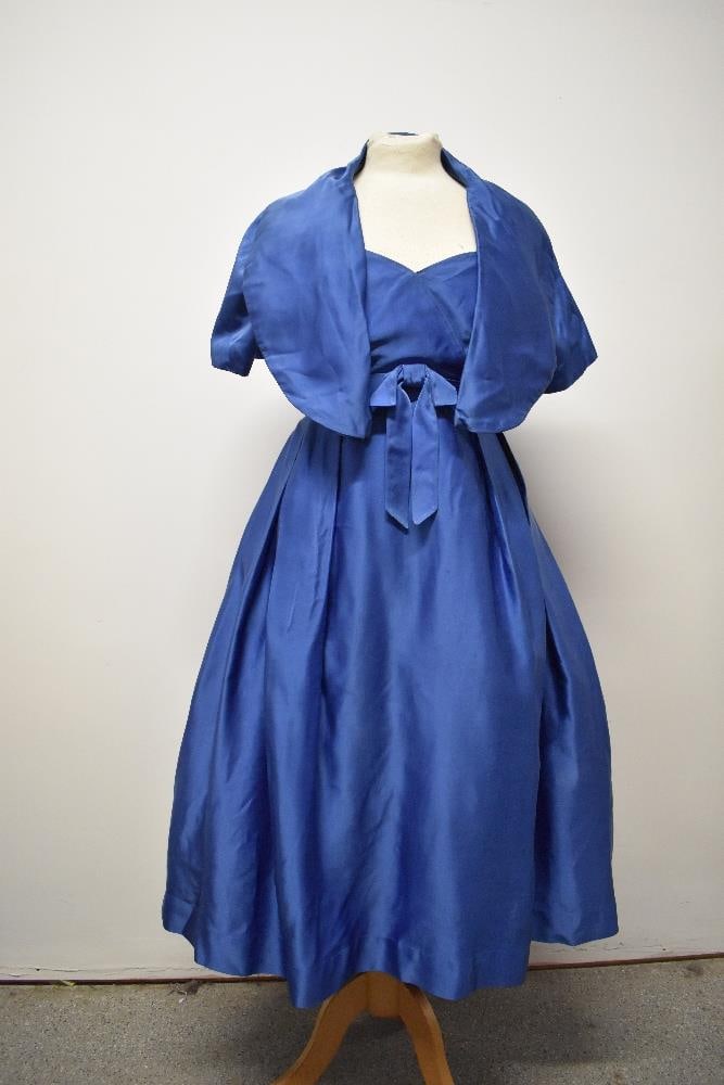 An electric blue satin 1950s strapless evening gown with matching jacket, having boned bodice, (1 of 9)