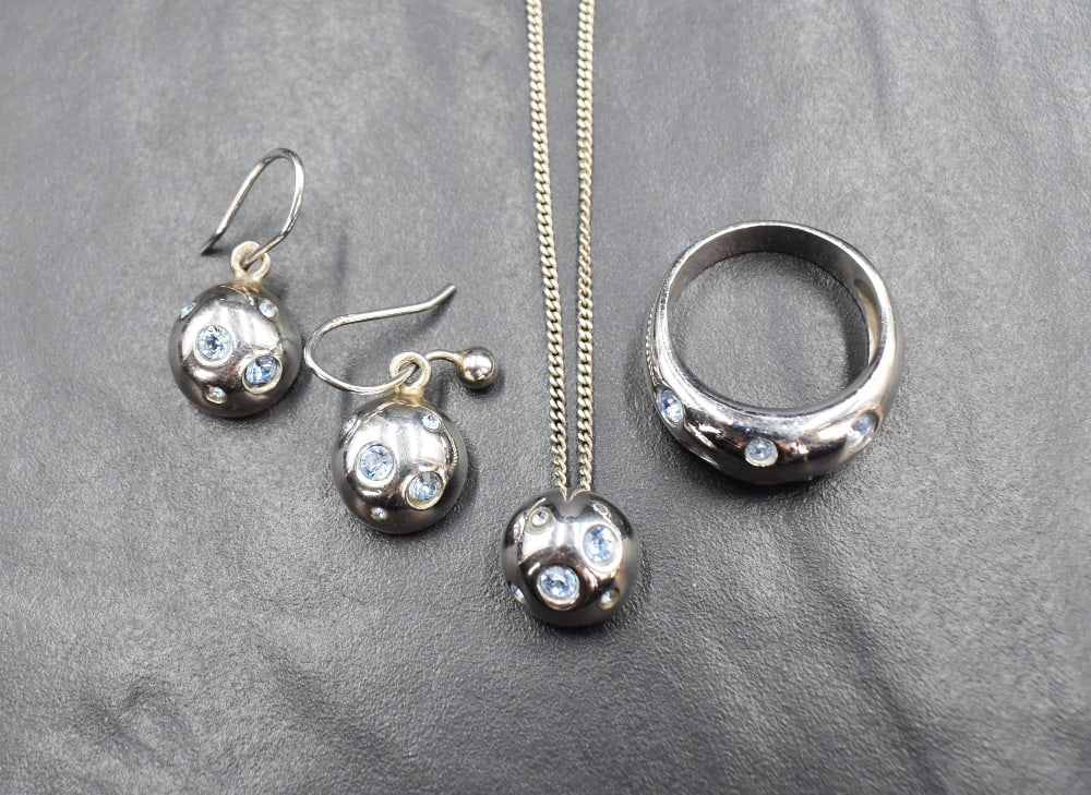 A French silver set of jewellery by Yves Saint Laurent comprising pendant, ring and earrings, all (1 of 1)