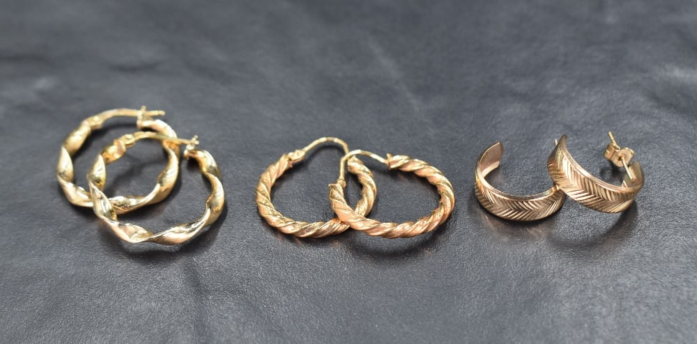 Three pairs of 9ct gold hoop earrings, two pairs of a twisted design and a pair of half-circle studs (1 of 1)