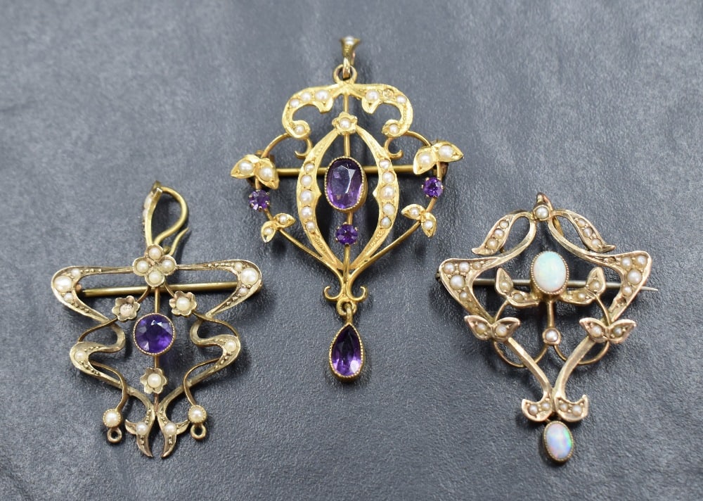 Three Edwardian yellow metal pendants, all stamped 9ct and having seed pearl decoration, two with (1 of 5)