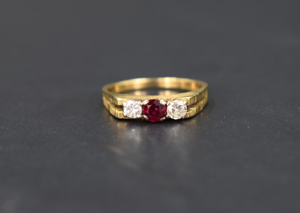 A diamond and ruby trilogy ring having three equal stones, each approx 0.128ct in a claw set mount (1 of 3)
