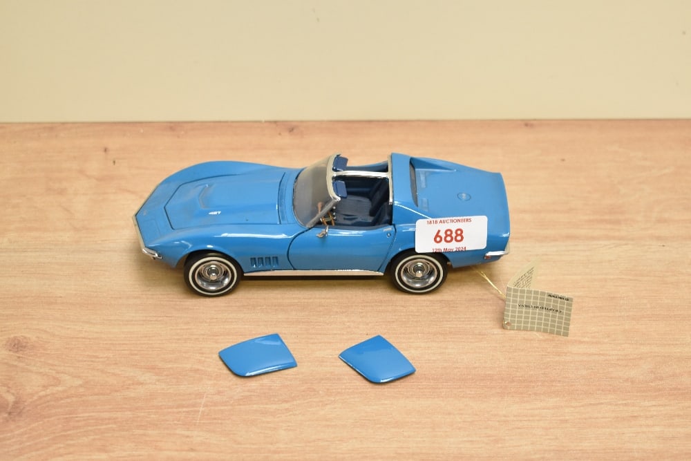 A 1989 Franklin Mint 1:24 scale Die-cast, 1968 Corvette with tag and certificates, in card box: A 1989 Franklin Mint 1:24 scale Die-cast, 1968 Corvette with tag and certificates, in card box with polystyrene cradle