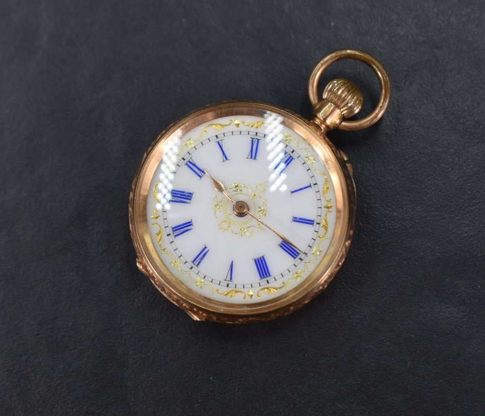 A small continental gold top wound pocket watch stamped 14K having blue Roman numeral dial with gilt (1 of 5)