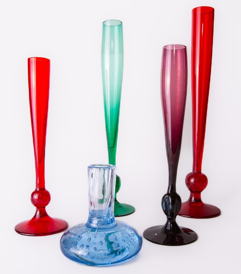 Two Whitefriars glass ruby red bud vases, of slender knopped flute form with conical circular foot, (1 of 3)