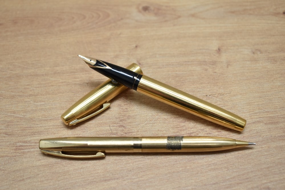 A Sheaffer Imperial 777 aerometric fill fountain pen and propelling pencil set in gold fill with (1 of 3)