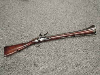 A 18th century Flintlock Blunderbuss having steel barrel, lock plate stamped FARMER & numbered 1?43,