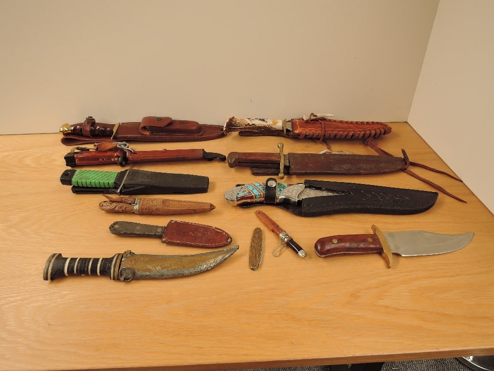 A collection of eleven Knives including five Bowie Knives along with one modern Bayonet and a: A collection of eleven Knives including five Bowie Knives along with one modern Bayonet and a reproduction Adolf Hitler Pen Knife