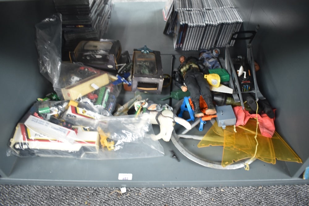 A shelf of modern toys including Action Man & Die-casts including Hot Wheels Racing etc along with: A shelf of modern toys including Action Man & Die-casts including Hot Wheels Racing etc along with older playworn Die-casts
