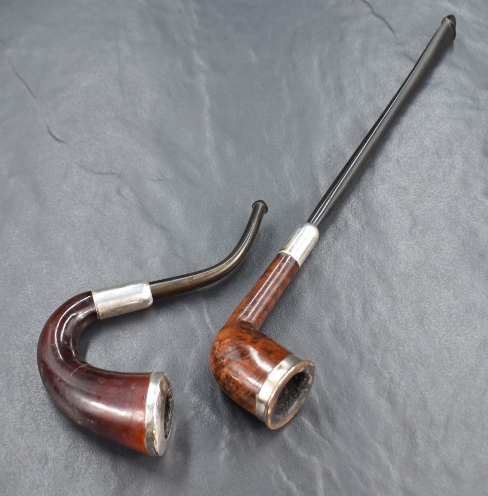 Two early 20th century silver mounted wooden tobacco smoking pipes, marks for Dublin and Chester, (1 of 4)