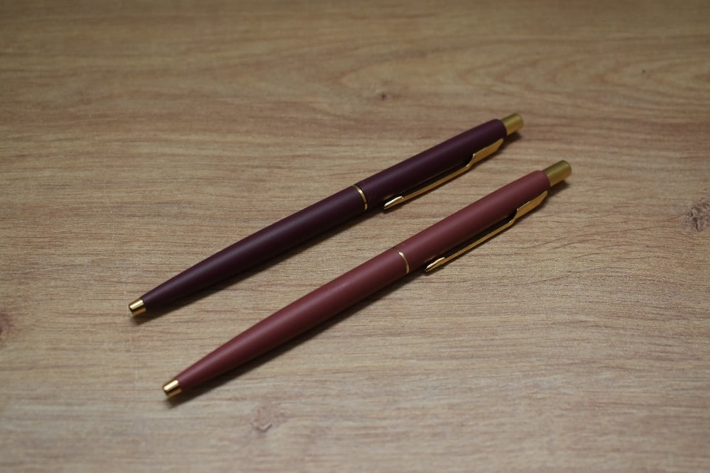 Two Parker Classic ballpoint pens in matte finish. One has crack to top (1 of 1)