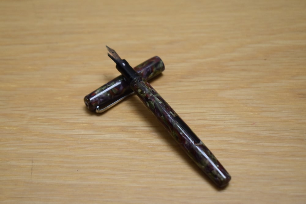 A Mabie Todd & Co Swan 100/59 self-filler lever fill fountain pen in Italian marble having Swan 1: A Mabie Todd & Co Swan 100/59 self-filler lever fill fountain pen in Italian marble having Swan 1 14CT Mabie Todd & Co nib