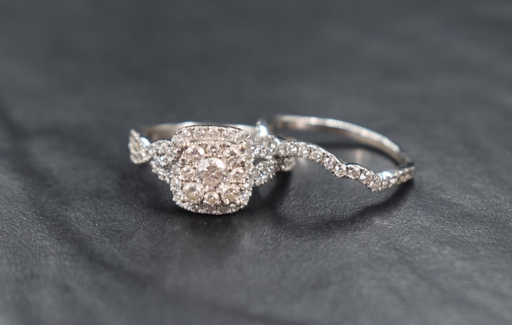 A 14ct white gold diamond cluster ring and band set, the square cluster with a central diamond (1 of 6)
