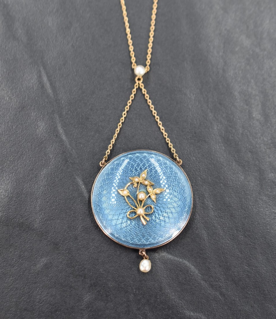 An Edwardian 15ct gold and turquoise enamel locket back pendant of circular form, the turquoise (1 of 3)
