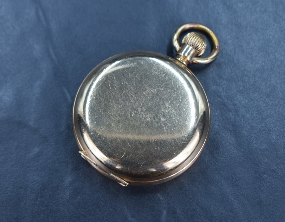 A gold plated Hunter pocket watch by Thos Russell & Son, movement no:13239, having Roman numeral: A gold plated Hunter pocket watch by Thos Russell & Son, movement no:13239, having Roman numeral dial with subsidiary seconds on a white enamelled face in a plain gold plated case, watch does tick